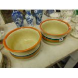 A pair of Clarice Cliff chamber pots