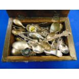 A collection of spoons in a box