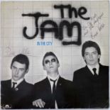 THE JAM - IN THE CITY SIGNED BY PAUL WELLER / BRUCE FOXTON.