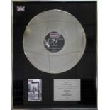 OASIS - A FRAMED AWARD SIGNED BY ALAN MCGEE.
