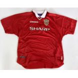 MANCHESTER UNITED - A SHIRT SIGNED BY TEDDY SHERINGHAM.