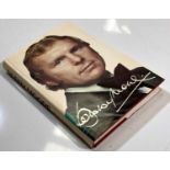 BOBBY MOORE - A SIGNED BOOK.