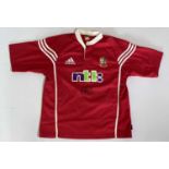 RUGBY UNION - A BRTISH LIONS SHIRT SIGNED BY JASON ROBINSON.