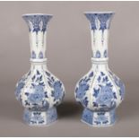 A pair of blue & white Delft vases. Marked to base dec 532. 24.5cm height.