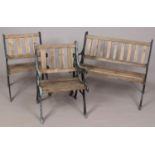 A three piece garden set, with cast iron arms. Comprises of two chairs and a two-seater bench.