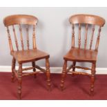 Two Ash/elm spindle back dining chairs.