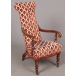 A Victorian mahogany Prie Dieu armchair, with red upholstery; raised on turned supports and small