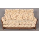 An Ercol 'New Renaissance' Three seat sofa in Golden Dawn finish, with light brown and cream