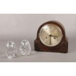 A Mahogany mantle clock & two glass paperweights.