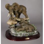 A Juliana Collection study of two elephants signed by Crosa 1999 on the back. Mounted on a wooden