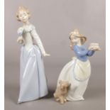 Two Nao Spanish porcelain young lady figures. Tallest: 23.5cm.