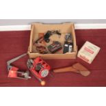 A box of reloading equipment. Including Lee cartridge press, Auto Disk Powder Measure, holsters,