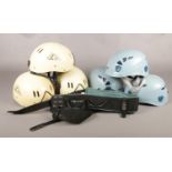 Six climbing helmets and a Black Diamond harness. To include three Petzl size 2 (53-61cm) and