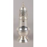 A George V silver sugar shaker. Assayed for London, 1933, by C Shapland & Co. Matching hallmarks
