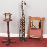 A collection of miscellaneous. Wooden decorative giraffe (103cm height), Oak framed wall mirror with