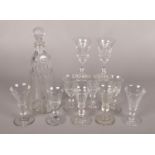 A collection of antique glass. Includes decanter and collection of fluted drinking glasses.
