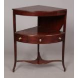 A George III mahogany corner washstand.