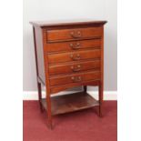 An Edwardian mahogany music cabinet with fitted sliding drawers. (84cm x 53cm x 35cm)