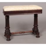 A rectangular mahogany piano/bedroom stool with cream upholstered seat pad. Raised on turned