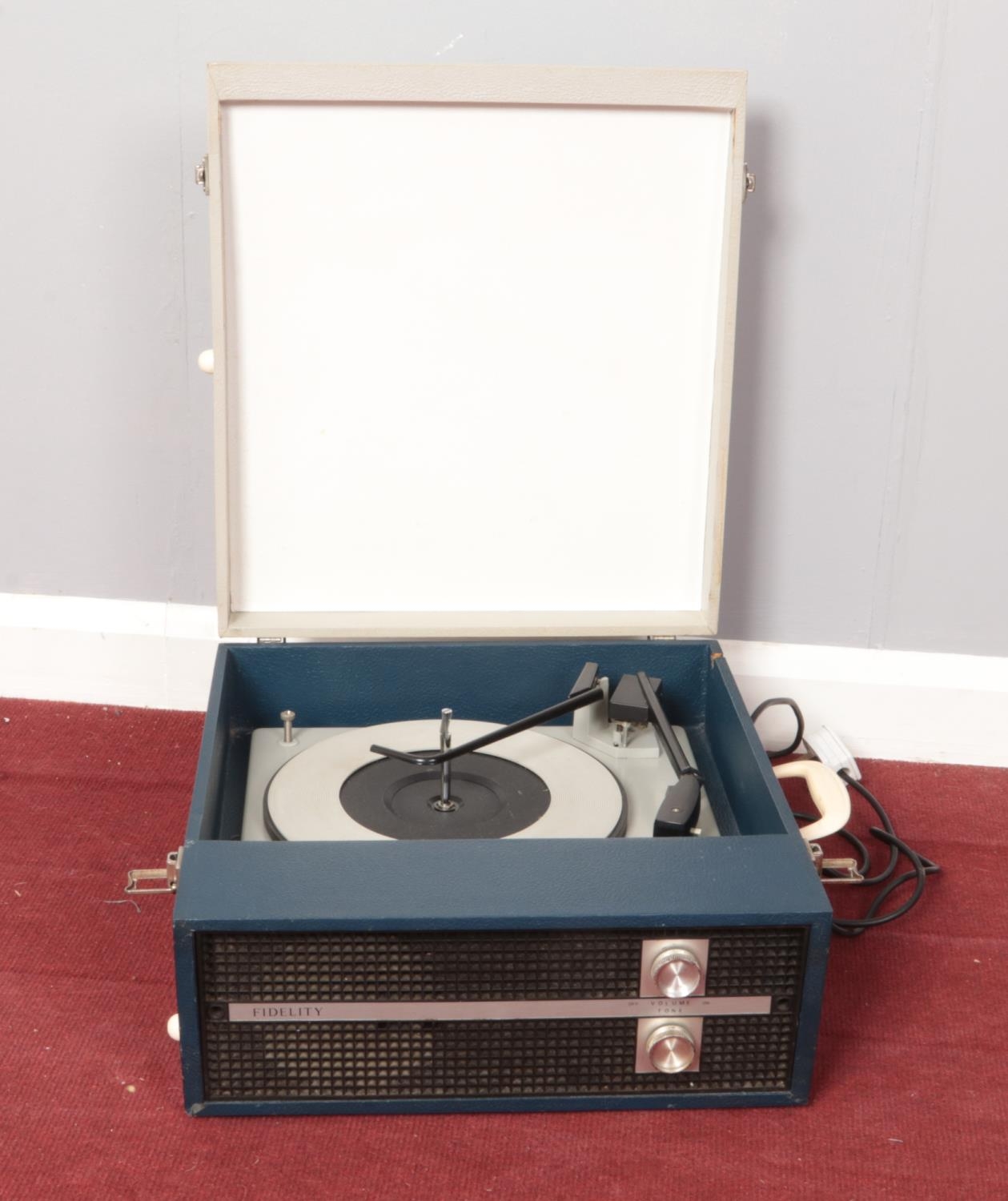 A Fidelity portable record player. Serial No. CP011707.