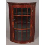 A Victorian mahogany glazed corner cupboard.