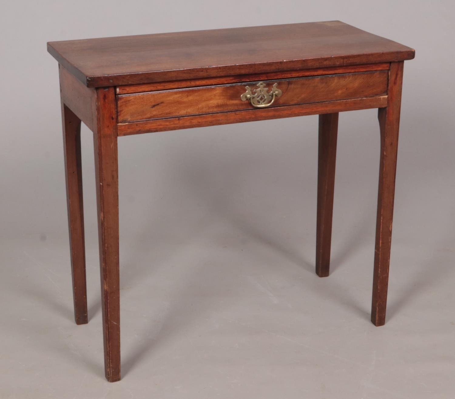 A George III mahogany side table with single drawer.