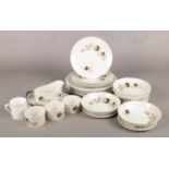 A quantity of mainly Royal Doulton dinnerwares in the Westwood pattern. Includes plates, bowls and