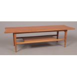 A retro teak two tier coffee table. (36cm x 132cm)