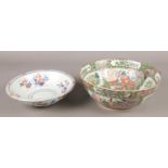 A late 19th century Chinese bowl, along with an Imari pattern bowl. Both repaired.