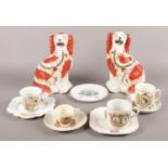 A pair of 19th century Staffordshire dogs, together with a collection of commemorative ceramics.