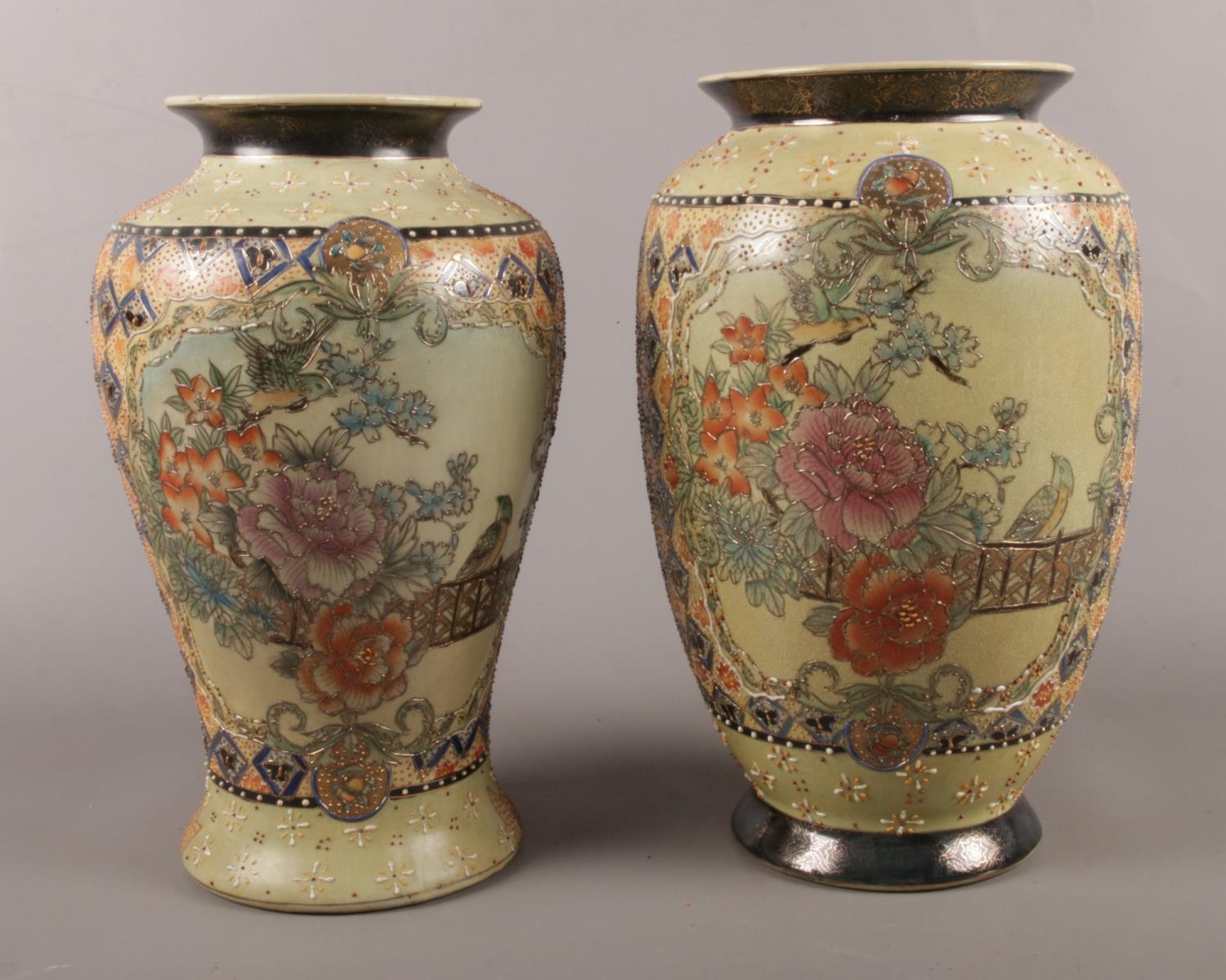 Two Chinese made vases. Comprising of raised floral and bird decoration. Largest: H:31cm The