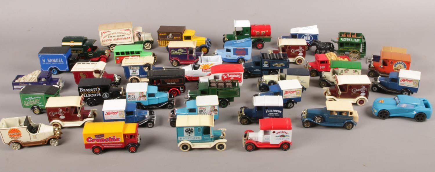 A box of die cast advertising vehicles. Corgi, Matchbox etc