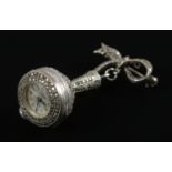 A silver and marcasite C. Bucherer manual watch brooch.