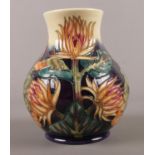 A Moorcroft 'Thistle' pottery vase. 16cm height.