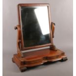 A Victorian Mahogany swing dressing table mirror. Comprising of a rectangle mirror with scroll