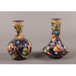 Two small Moorcroft pottery vases. 11cm height.