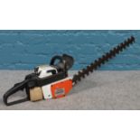 A Stihl HS60AV petrol hedge trimmer.