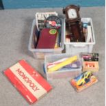 Two boxes of miscellaneous. Includes board games, karate belts, books, clock etc.