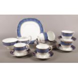A Salisbury blue/gold part tea set. cups/saucers, milk jug, sugar bowl etc.