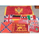 A quantity of flags. Including Montenegro, Scotland, United Kingdom hand flags, etc.