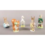 A collection of Royal Albert/ Royal Doulton Beatrix Potter figurines. Squirrel Nutkin, Mr Benjamin