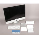 An Apple iMac 21.5inch LED 16:9 widescreen computer in original box. Including wireless keyboard and