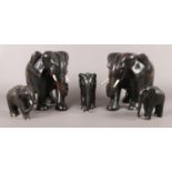 A series of five carved ebonised elephants. Tallest: 20cm.