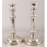 A pair of large ornate Sheffield plate candlesticks with detachable nozzles. 31cm.