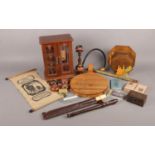 A box of miscellaneous items. To include miniature cupboard with four drawers, cheese board with