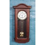 A William Widdop mahogany 8 day wall clock.