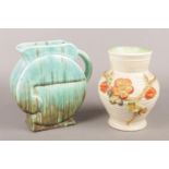 A Clarice Cliff pottery vase with floral decoration along with a Beswick Ware jug.