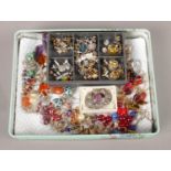 A large collection of screw back and stud earrings.