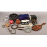 A box of collectables. Includes keys, wooden match box holder, magnifying glass, onyx dice etc.