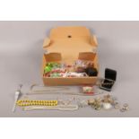 A box of assorted costume jewellery. To include an 18ct rolled gold bracelet, rings, necklaces and